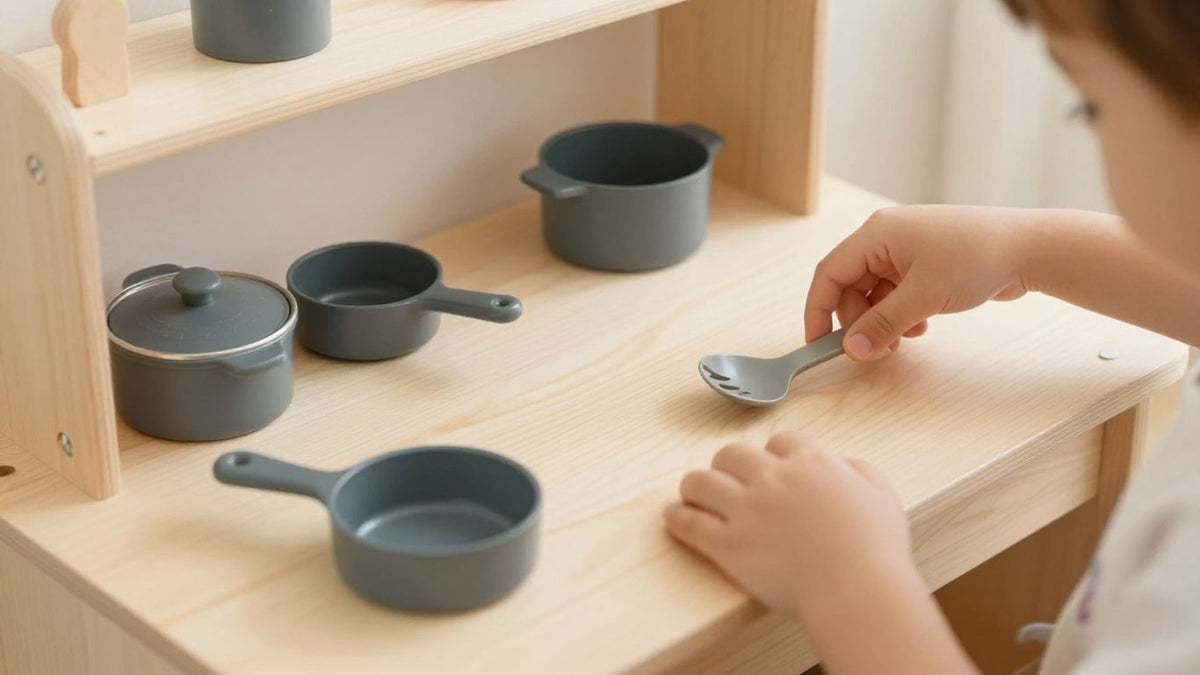 Wooden play kitchen with child's hands reaching for food.