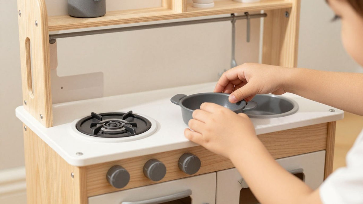 Wooden kitchen playset with child's hands cooking