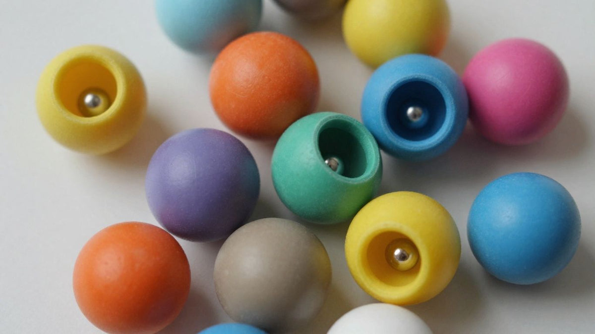 Colorful toys with small magnets visible inside.