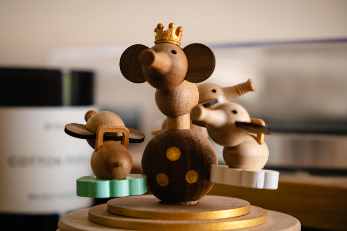 A group of wooden mice on top of a table